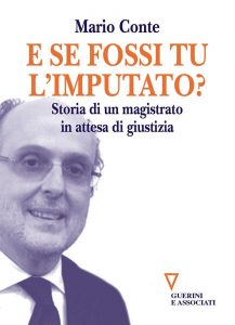 Qui sopra, la copertina del libro. In alto, ol magistrato con Antonio Di Pietro